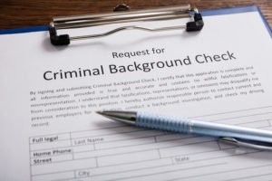 paper that says "criminal background check"