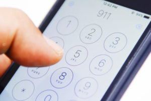 Hand dialling 911 on cell phone