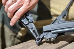 Man with pliers altering gun