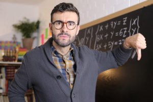 Teacher in front of a blackboard