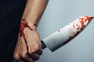 Man holding bloody knife