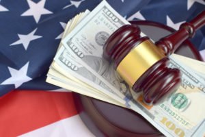 Gavel and a wad of cash