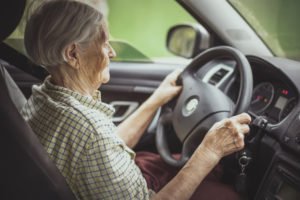 Elderly woman driving a car
