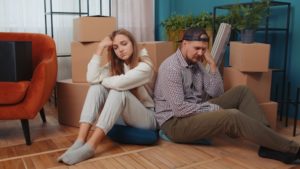 A divorcing couple packing up their apartment