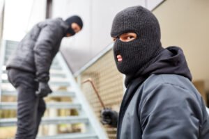 Two men in masks burgling a store in violation of PC 459