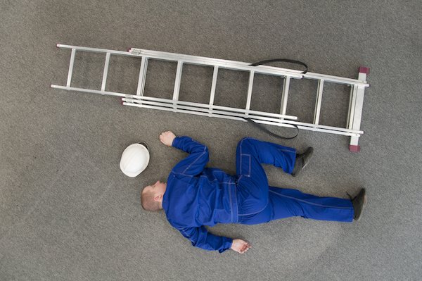 Worker on floor after fall from ladder