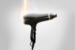 defective hair dryer on fire
