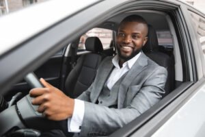 Man in business suit driving