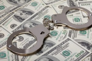 Handcuffs on top of cash