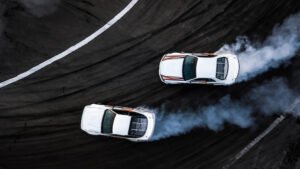 Birds-eye view of two cars drag racing