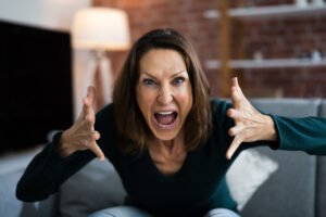 Angry woman yelling at camera