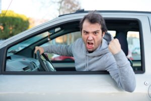 An angry man in a car making a criminal threat in violation of PC 422