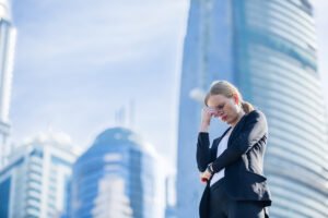 Attorney holding her head in her hand in frustration