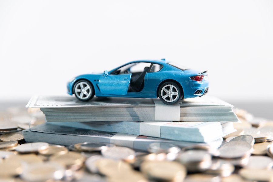 Toy car on top of cash